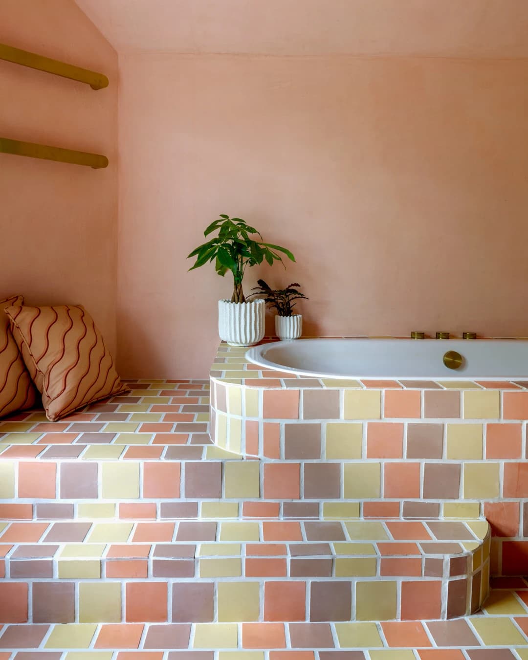 Original arrangement of 10x10 cement tiles on a bathroom floor.